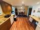 Open kitchen layout with wood cabinets and countertops, leading to dining area and breakfast nook at 8508 43Rd W Ave, Bradenton, FL 34209