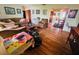 Spacious living room with hardwood floors, comfortable seating, and lots of natural light at 8508 43Rd W Ave, Bradenton, FL 34209
