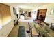 Spacious living room with carpeted floors, large windows, and comfortable seating area at 8508 43Rd W Ave, Bradenton, FL 34209
