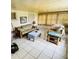 Sunroom featuring tile floors, and a seating arrangement offering natural light at 8508 43Rd W Ave, Bradenton, FL 34209