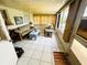 Sunroom featuring tile floors, and a seating arrangement offering natural light at 8508 43Rd W Ave, Bradenton, FL 34209