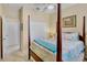 Bedroom with four poster bed, ceiling fan, and closet at 9052 41St E St, Parrish, FL 34219