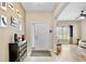 Bright foyer featuring tile flooring, a stylish entry door, and decorative accents creating a welcoming entrance at 9052 41St E St, Parrish, FL 34219