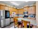 Beautiful kitchen features a breakfast bar, stainless steel appliances, and ample cabinetry at 9052 41St E St, Parrish, FL 34219