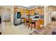 Well-equipped kitchen with stainless steel appliances, granite countertops, and a breakfast bar at 9052 41St E St, Parrish, FL 34219