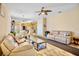 Open-concept living room with wood flooring and neutral decor throughout the main living spaces at 9052 41St E St, Parrish, FL 34219