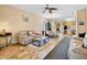 Cozy living room boasts natural light, wood floors and is open to the kitchen and dining areas at 9052 41St E St, Parrish, FL 34219