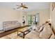 Bright living room with sliding glass doors that lead to the lanai and Primary bedroom is adjacent at 9052 41St E St, Parrish, FL 34219