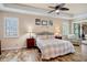 Spacious main bedroom features wood-style floors, tray ceiling, and shuttered windows at 9052 41St E St, Parrish, FL 34219