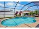 Enclosed swimming pool surrounded by pavers, a fountain, and various plants at 9052 41St E St, Parrish, FL 34219
