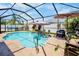 Beautiful pool area surrounded by lush landscaping, with lounge chairs and umbrellas for ultimate relaxation at 9052 41St E St, Parrish, FL 34219