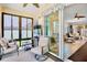 Cozy sunroom with comfortable seating, perfect for enjoying the outdoors from the comfort of inside at 9052 41St E St, Parrish, FL 34219
