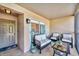 Cozy condo balcony with comfortable seating, perfect for relaxing and enjoying the view at 9560 High Gate Dr # 1622, Sarasota, FL 34238