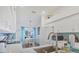 Bright eat-in kitchen features white cabinetry, quartz countertops, and stainless steel appliances at 9560 High Gate Dr # 1622, Sarasota, FL 34238