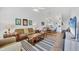 Open-concept living area with a comfortable sofa, stylish decor, and seamless flow to the dining area at 9560 High Gate Dr # 1622, Sarasota, FL 34238