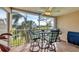 Relaxing screened patio featuring comfortable seating and serene golf course views, perfect for enjoying the outdoors at 9560 High Gate Dr # 1622, Sarasota, FL 34238