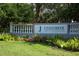 Welcoming entrance sign for Stoneybrook Golf & Country Club, beautifully landscaped with colorful flowers at 9560 High Gate Dr # 1622, Sarasota, FL 34238