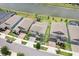 Aerial view of home showing yard, nearby lake, and surrounding neighborhood at 9646 Ivory Dr, Ruskin, FL 33573