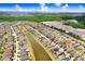 Magnificent aerial view of a neighborhood with a pond and beautiful landscaping at 9646 Ivory Dr, Ruskin, FL 33573