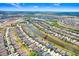 Picturesque aerial view of a neighborhood with a pond and beautifully landscaped yards at 9646 Ivory Dr, Ruskin, FL 33573