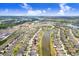 Gorgeous aerial view of a neighborhood with lush landscaping and a pond at 9646 Ivory Dr, Ruskin, FL 33573