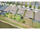 Aerial view of home highlighting the backyard, landscaping, and proximity to a pond at 9646 Ivory Dr, Ruskin, FL 33573