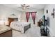 Comfortable bedroom with a ceiling fan, soft carpet, and bright window, creating a relaxing atmosphere at 9646 Ivory Dr, Ruskin, FL 33573
