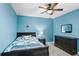 Comfortable bedroom with a single bed, side table, and dresser with mirror at 9646 Ivory Dr, Ruskin, FL 33573