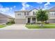 Attractive two-story house with a two-car garage, covered porch, and well-maintained landscaping at 9646 Ivory Dr, Ruskin, FL 33573