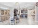 Open floor plan features kitchen with dark cabinets, granite countertops, and stainless steel appliances at 9646 Ivory Dr, Ruskin, FL 33573