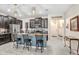 Stylish kitchen with dark cabinetry, granite counters, and a center island with barstool seating at 9646 Ivory Dr, Ruskin, FL 33573
