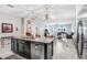 Bright open kitchen featuring granite countertops, stainless steel appliances, and seamless flow into the living room at 9646 Ivory Dr, Ruskin, FL 33573