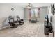 Spacious living room featuring a modern tv, fan, and decor, perfect for relaxation and entertainment at 9646 Ivory Dr, Ruskin, FL 33573