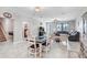 Bright living room shows tile flooring, neutral paint, ceiling fan and is adjacent to a bedroom and entryway at 9646 Ivory Dr, Ruskin, FL 33573