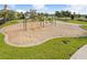 Community playground with swings and slides, offering a fun and safe area for children at 9646 Ivory Dr, Ruskin, FL 33573