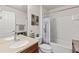 Bathroom features double sink vanity, tub with shower, and toilet at 9840 50Th Street E Cir, Parrish, FL 34219