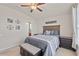 Comfortable bedroom with stylish decor, ceiling fan, and ample natural light at 9840 50Th Street E Cir, Parrish, FL 34219