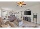 Inviting living room featuring an open layout, comfortable seating, and a large television at 9840 50Th Street E Cir, Parrish, FL 34219