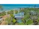 Aerial view of a coastal home featuring a pool and easy beach access at 1042 N Casey Key Rd, Osprey, FL 34229