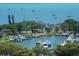 Picturesque aerial view of a marina with sailboats and yachts docked in calm blue waters at 1042 N Casey Key Rd, Osprey, FL 34229
