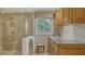 Bathroom with glass shower, storage, marble countertops, and decor at 1042 N Casey Key Rd, Osprey, FL 34229