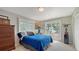 Comfortable bedroom with exterior access, a view, and ample storage space at 1042 N Casey Key Rd, Osprey, FL 34229