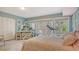 Charming bedroom featuring a decorative vanity, french doors, and treadmill for home fitness convenience at 1042 N Casey Key Rd, Osprey, FL 34229