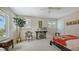 Bedroom with neutral carpet, unique decor, and multiple windows for natural light at 1042 N Casey Key Rd, Osprey, FL 34229