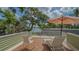 Relaxing deck with comfortable lounge chairs overlooking the water and lush landscaping at 1042 N Casey Key Rd, Osprey, FL 34229