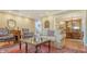 Comfortable living room featuring a plush sofa, hardwood floors, and elegant decor at 1042 N Casey Key Rd, Osprey, FL 34229