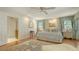Relaxing main bedroom with wood flooring, decor, and an ensuite bathroom at 1042 N Casey Key Rd, Osprey, FL 34229