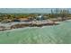 Stunning waterfront home with private beach access and breathtaking ocean views, surrounded by lush greenery at 1042 N Casey Key Rd, Osprey, FL 34229