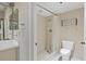 Cozy bathroom featuring a step-in shower, a toilet, and modern fixtures at 1065 Gulf Of Mexico Dr # 103, Longboat Key, FL 34228