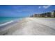 Beachfront property featuring direct access to pristine sandy shores, offering a tranquil and relaxing escape at 1065 Gulf Of Mexico Dr # 103, Longboat Key, FL 34228